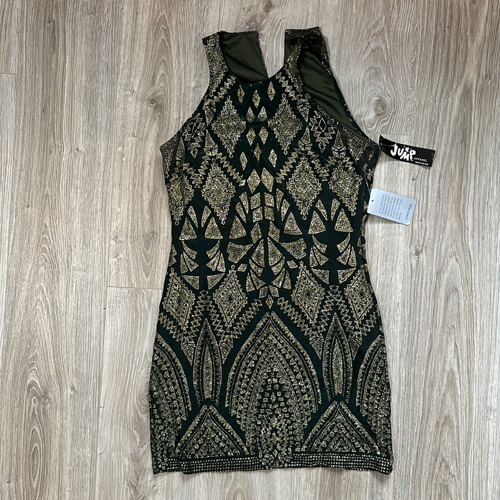 Green with gold glitter dress. Sleeveless. Perfect for a winter wedding guest!
